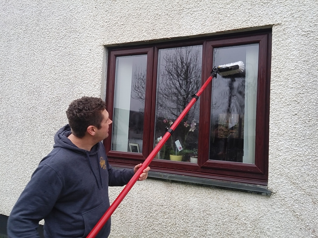 Cleaning windows in Lostwithiel